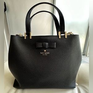 Kate Spade black leather satchel with pink suede lining.